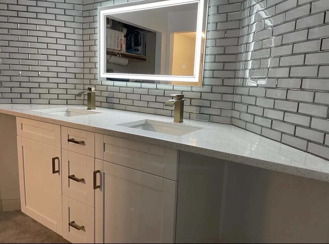 Bathroom vanity with lighted mirror and quartz countertop